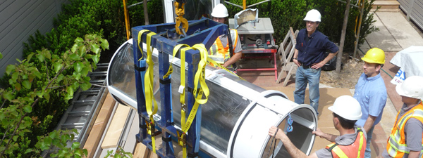 Workers with tube elevator